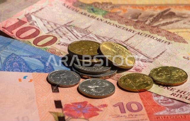 Money, Banknote of Ringgit Malaysia, Singapore dollar and Saudi Arabia Riyals for background, selected focus. Business, Finance, Economy and Investmen Money, Banknote of Ringgit Malaysia, Singapore dollar and Saudi Arabia Riyals for background, selected focus. Business, Finance, Economy and Investmen