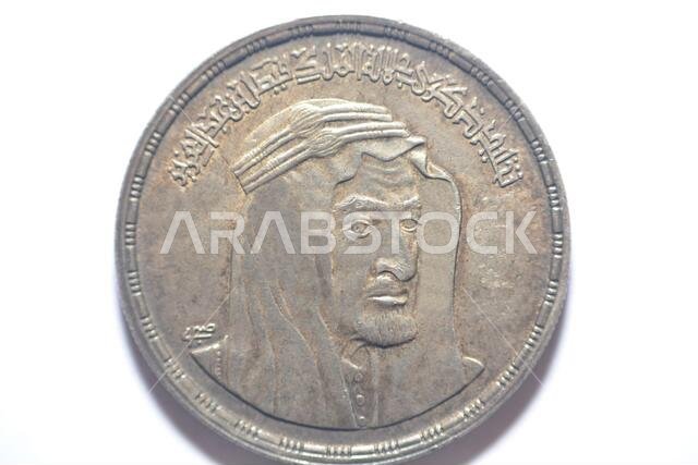 The obverse side of Egyptian one pound coin, 1 LE coin year 1976, 1396 AH with Bust of King Faisal half right, Translation (Commemoration of His Majes The obverse side of Egyptian one pound coin, 1 LE coin year 1976, 1396 AH with Bust of King Faisal half right, Translation (Commemoration of His Majes