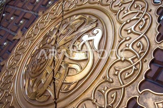 Muhammad Rasulullah. Prophet Muhammad name written on the door of the mosque Nabawi in Medina, Saudi Arabia