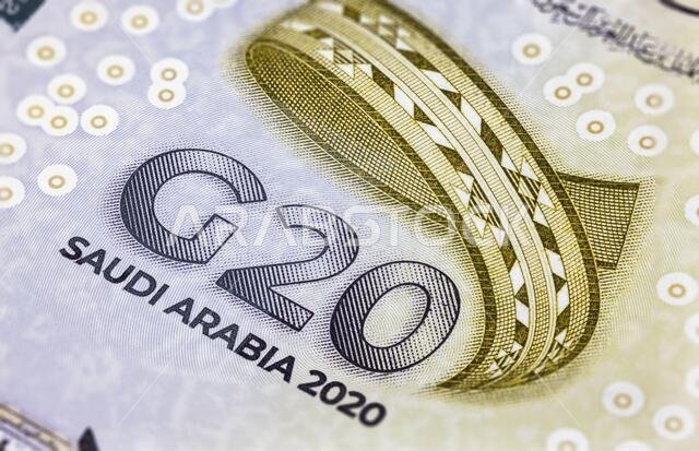 Detailed close up of 20 Saudi Riyal. Saudi Arabian currency for the G20 summit in 2020. Money of Saudi Arabia. World map on the reverse side of twenty