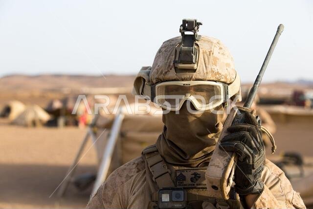 210309-M-JX780-2036 TABUK, Kingdom of Saudi Arabia (March 9, 2021) – U.S. Marine Corps Sgt. Alec Cano, an aircraft rescue and firefighting specialist assigned to Marine Medium Tiltrotor Squadron 164 (Reinforced), 15th Marine Expeditionary Unit (MEU), uses a radio at a forward arming and refueling point during a theater amphibious combat rehearsal (TACR) in Tabuk, Kingdom of Saudi Arabia, March 9. TACR integrates U.S. Navy and Marine Corps assets to practice and rehearse a range of critical comba