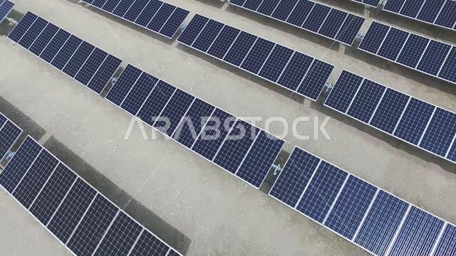 aerial drone top view of solar energy panels or photovoltaic PV module in the desert.