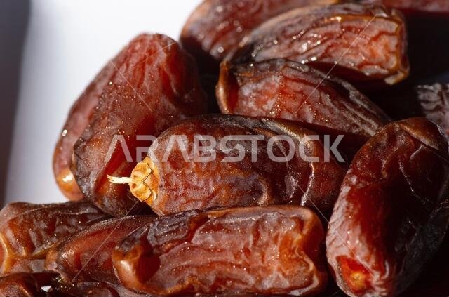 Sweet Khalas dates fruit from Saudi Arabia in the white plate ready for ramadan
