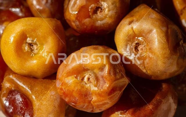 Close up of sweet sukkari dates fruit  (Kurma Sukkari) from Saudi Arabia ready for ramadan
