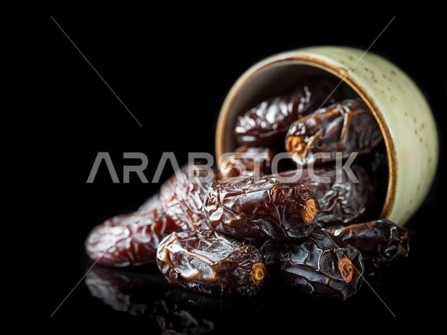 Dates fruit and rosary still life against on white background. Ramadan background greeting card. Ramadan Kareem. Traditional culture of the Middle Eas