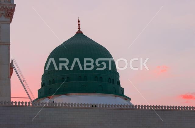 Al-Masjid An-Nabawi - The Prophet Mosque. Iftar time for Ramadan. Sunset at Medina. The famous Green Dome.