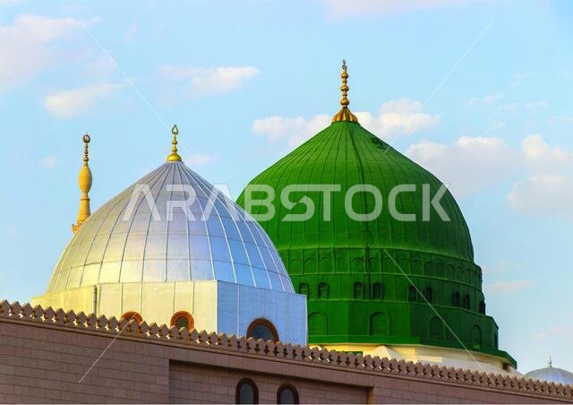The famous green and silver domes of the Prophet's Mosque. The mosque was founded by Prophet Muhammad. Masjid an-Nabawi.