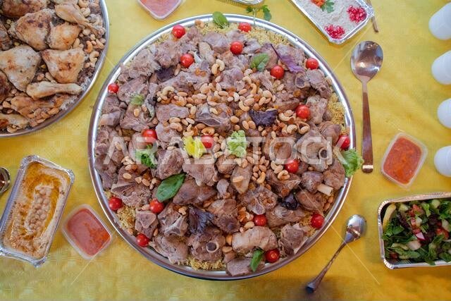 Kabsa or makbus or Mandi.A dish is made with rice and meat. found in  Yemen, Somalia, Qatar, Oman, the United Arab Emirates, Bahrain, Saudi Arabia
