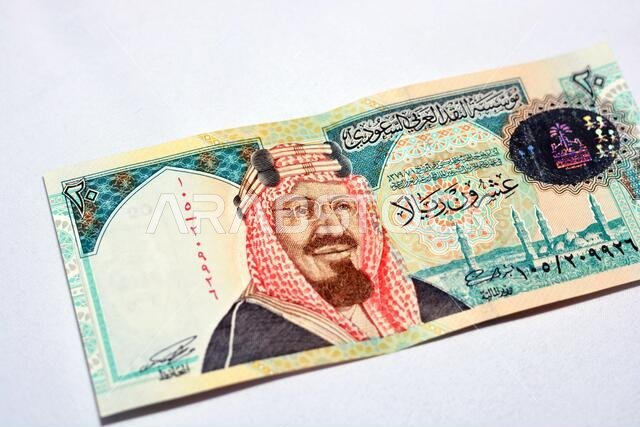 Saudi Arabia 20 riyals banknote, The Saudi riyal is the currency of Saudi Arabia, selective focus of Saudi kingdom twenty riyals cash