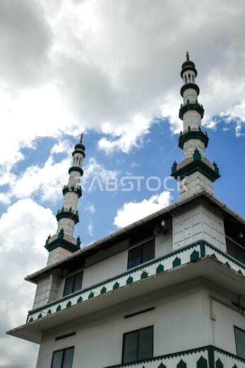masjid minarets against blue sky masjid minarets against blue sky
