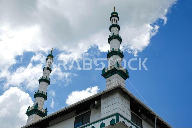 masjid minarets against blue sky