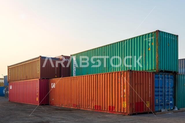 Stacked cargo containers in storage area of freight sea port terminal. Dammam, Saudi Arabia.26-March-2021.