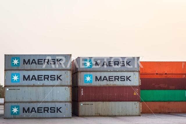 Stacked cargo containers in storage area of freight sea port terminal. Dammam, Saudi Arabia.26-March-2021.