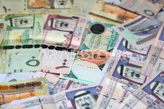 collection of Saudi Arabia money background, different Saudi riyals collection of 100, 50, 20, 10, 5 and 1 riyal, selective focus of Saudi money.