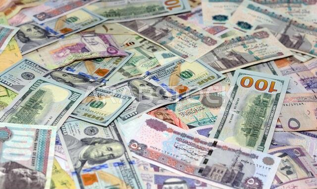 Saudi Arabia currency with USA currency and Egypt currency banknotes . Saudi Arabia riyals, Egyptian pounds and American dollars exchange rate