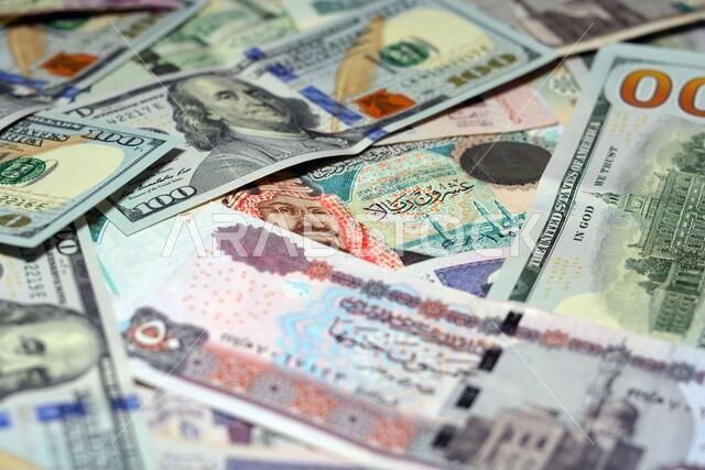 Saudi Arabia currency with USA currency and Egypt currency banknotes . Saudi Arabia riyals, Egyptian pounds and American dollars exchange rate