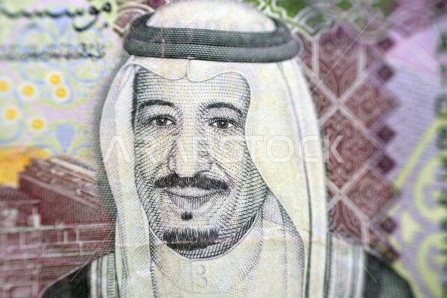 A close-up portrait of King Salman Bin Abdulaziz Al-Saud from the Observe side of 5 Saudi riyals banknote money, King Salman is the Saudi king