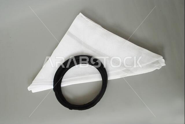 Arabic traditional clothing accessories for head dress white Ghutrah and Agal with grey background