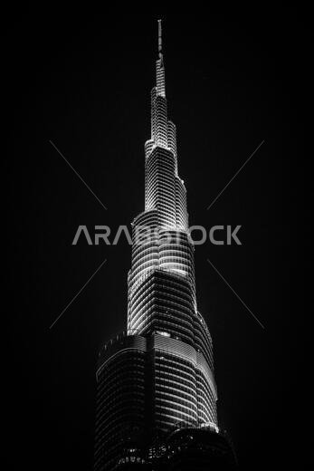 The top of the iconic skyscraper Burj Khalifa at night time