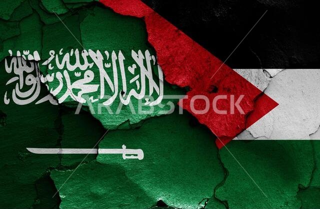 flags of Saudi Arabia and Palestine painted on cracked wall
