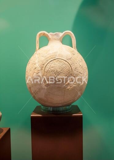 Lisbon, Portugal - March the 1st, 2020: Pilgrim flask from Khor Fakkan, United Arab Emirates. 15th Century pottery. National Archaeology Museum, Lisbo Lisbon, Portugal - March the 1st, 2020: Pilgrim flask from Khor Fakkan, United Arab Emirates. 15th Century pottery. National Archaeology Museum, Lisbo