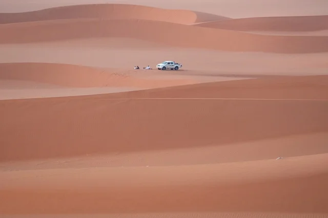 White Pickup Truck in Al Nafud Desert Dunes