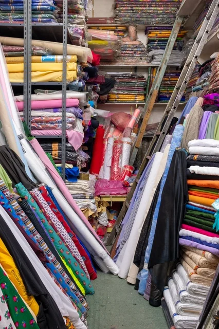 Colorful Fabric Rolls in Traditional Market Shop