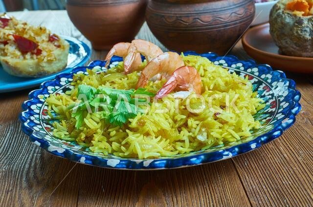 Mumawwash classic dish from Kuwait combines rice topped with dry shrimp.