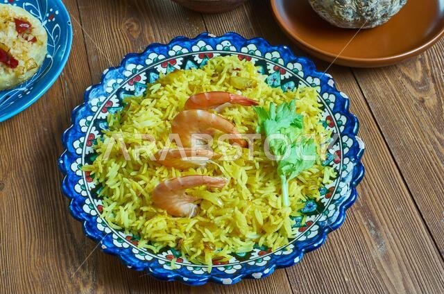 Mumawwash classic dish from Kuwait combines rice topped with dry shrimp.