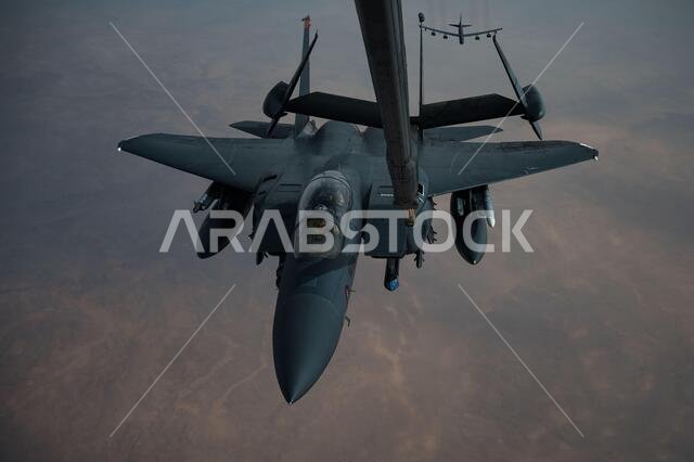 Persian Gulf, Saudi Arabia. 27th Jan, 2021. A U.S. Air Force F-15E Strike Eagle fighter aircraft refuels from a KC-135 Stratotanker during a short-duration deployment to the middle east January 27, 202 over the Persian Gulf. The fighter is escorting B-52 Stratofortress strategic bombers from the 2nd Bomb Wing. Credit: Planetpix/Alamy Live News