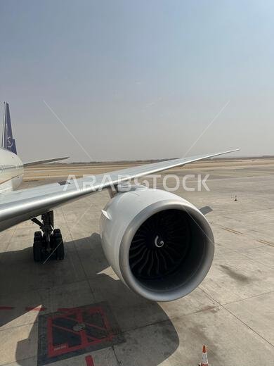 Riyadh , Saudi Arabia - Mar 11 2023 : Passengers traveling through Saudi Airlines flight - Airplane from outside flight  and booking concept