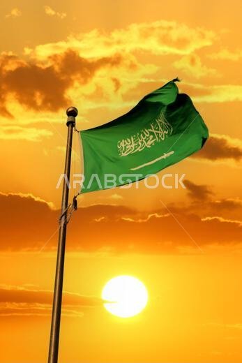 Saudi Arabia national flag waving at sunset. Islamic religion flag.
