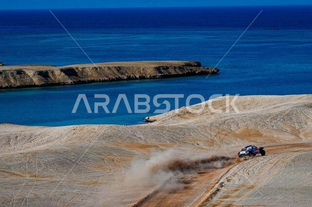 نيوم، المملكة العربية السعودية. ١٢ يناير ٢٠٢١. #٣٠٠ ساينز كارلوس (إسبانيا)، كروز لوكاس (إسبانيا)، ميني، فريق إكس-ريد ميني جيه سي دبليو، سيارة، خلال المرحلة التاسعة من رالي داكار ٢٠٢١ بين نيوم ونيوم، في المملكة العربية السعودية بتاريخ ١٢ يناير ٢٠٢١ - صورة إريك فارغيولو/DPPI/LM. حقوق الصورة: Gruppo Editoriale LiveMedia/Alamy Live News