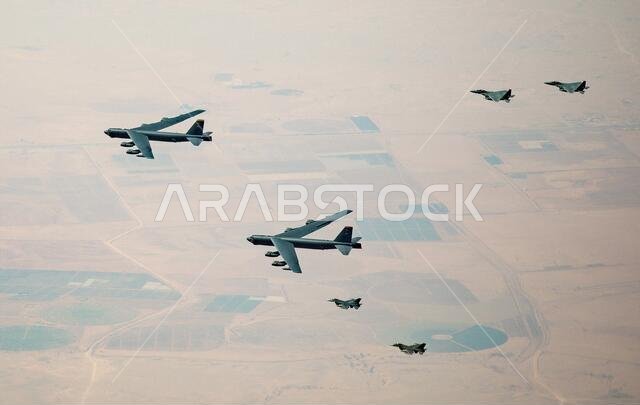 Saudi Arabia, Saudi Arabia. 09th Jan, 2021. U.S. Air Force B-52 Stratofortress strategic bomber aircraft are escorted by Royal Saudi Arabian Air Force F-15S/A fighters, right, and U.S. Air Force F-16 Fighting Falcons as they fly over Saudi airspace January 7, 2021 in Saudi Arabia. The bomber and escort is a show of force mission as a message to Iran. Credit: Planetpix/Alamy Live News Saudi Arabia, Saudi Arabia. 09th Jan, 2021. U.S. Air Force B-52 Stratofortress strategic bomber aircraft are escorted by Royal Saudi Arabian Air Force F-15S/A fighters, right, and U.S. Air Force F-16 Fighting Falcons as they fly over Saudi airspace January 7, 2021 in Saudi Arabia. The bomber and escort is a show of force mission as a message to Iran. Credit: Planetpix/Alamy Live News