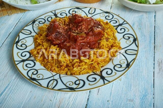 Machboos laham - national dish of Kuwait, machboos laham combines basmati rice and meat with a mixture of fried onions, raisins