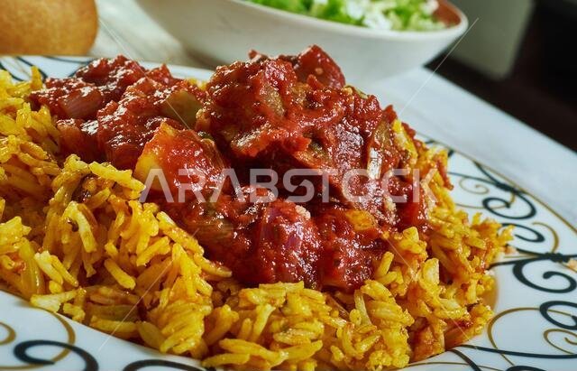 Machboos laham - national dish of Kuwait, machboos laham combines basmati rice and meat with a mixture of fried onions, raisins