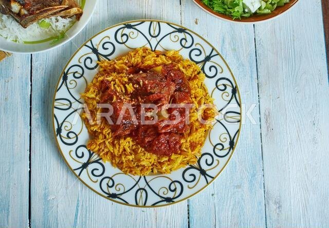 Machboos laham - national dish of Kuwait, machboos laham combines basmati rice and meat with a mixture of fried onions, raisins