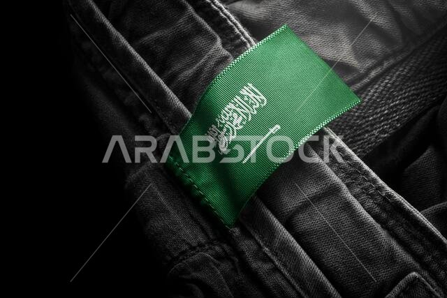 Tag on dark clothing in the form of the flag of the Saudi Arabia