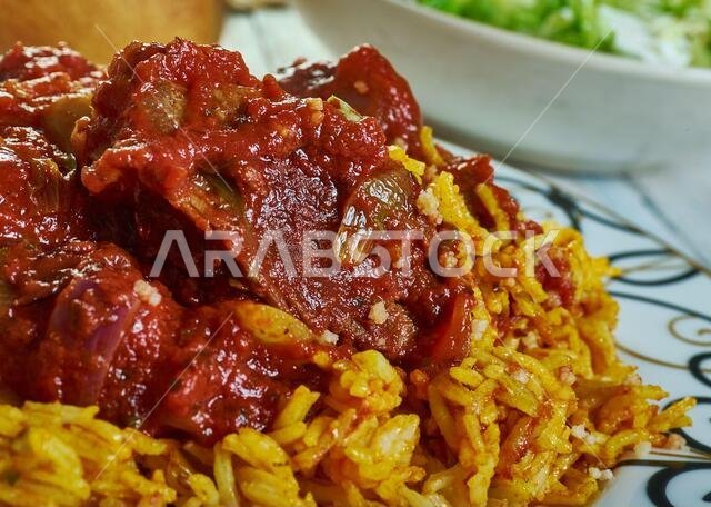 Machboos laham - national dish of Kuwait, machboos laham combines basmati rice and meat with a mixture of fried onions, raisins