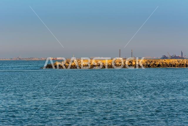 Stone dam under twilight at the sea of Dammam, Kingdom of Saudi Arabia