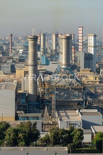 Middle East oil refinery equipment along the coastline for gas, water and oil concepts. Industrial zone.