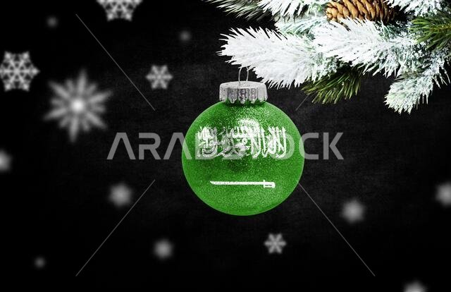 Happy new Year 2021, flag of Saudi Arabia on a christmas toy, decorations isolated on dark background. Creative christmas concept.