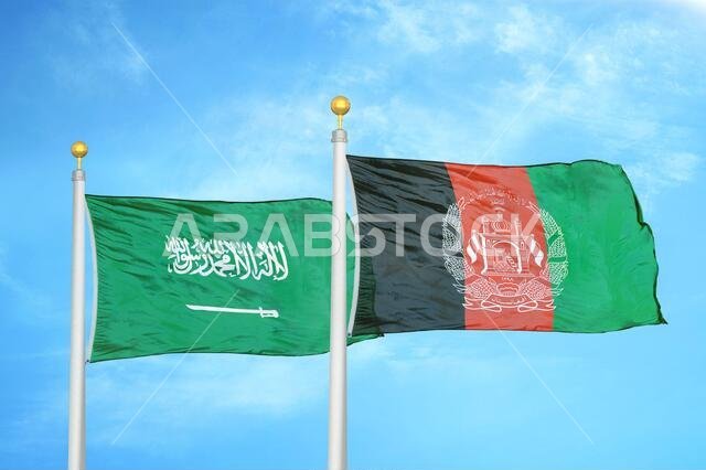 Saudi Arabia and Afghanistan two flags on flagpoles and blue cloudy sky