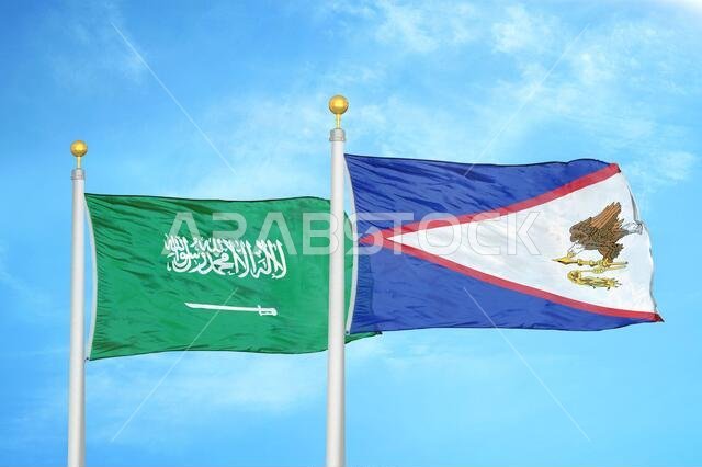 Saudi Arabia and American Samoa two flags on flagpoles and blue cloudy sky