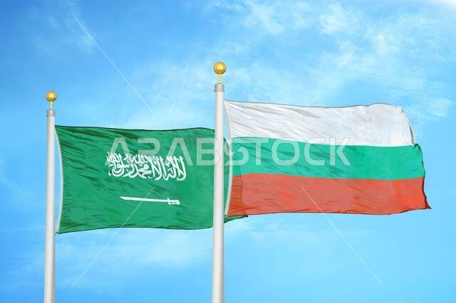 Saudi Arabia and Bulgaria two flags on flagpoles and blue cloudy sky