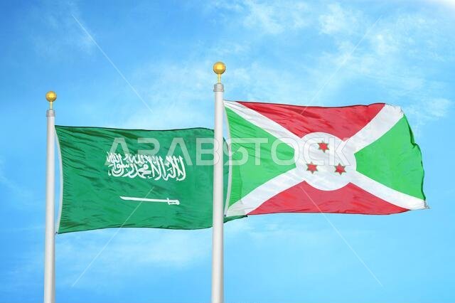 Saudi Arabia and Burundi two flags on flagpoles and blue cloudy sky