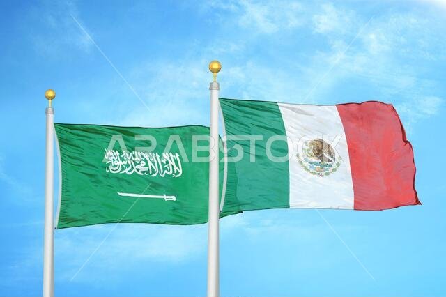 Saudi Arabia and Mexico two flags on flagpoles and blue cloudy sky