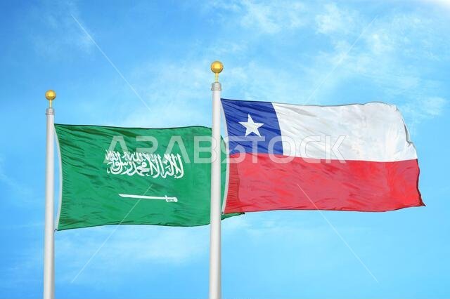 Saudi Arabia and Chile two flags on flagpoles and blue cloudy sky