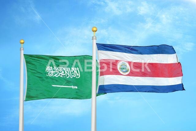 Saudi Arabia and Costa Rica two flags on flagpoles and blue cloudy sky