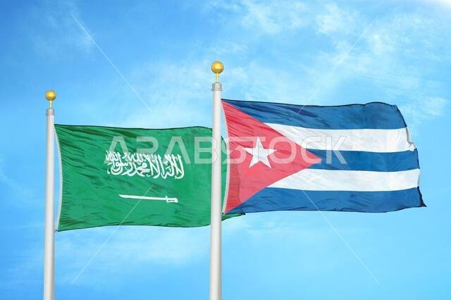 Saudi Arabia and Cuba two flags on flagpoles and blue cloudy sky